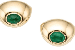 2 Cabochon Emeralds approximately 5 total carats in 18k gold by Poiray of Paris, France.