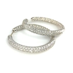 Luxurious diamond-studded hoop earrings perfect for special occasions or everyday elegance. Crafted with high-quality materials, these earrings add sparkle and sophistication to any outfit. Earrings
