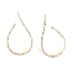 Luxurious diamond hoop earrings showcasing sparkling, high-quality gemstones set in a delicate, curved design. Perfect for adding a touch of sophistication and glamour to any outfit. Earrings