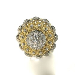 A stunning gold and diamond cluster ring featuring a central arrangement of sparkling diamonds surrounded by a gold floral design, perfect for special occasions or as a luxurious gift. Rings