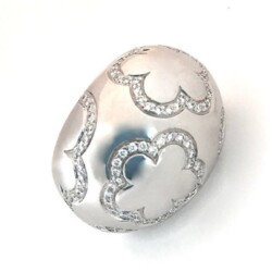 A stunning silver ring featuring intricate cut-out floral patterns outlined with sparkling crystals, perfect for jewelry collectors and fashion enthusiasts. This piece combines elegance and craftsmanship, ideal for both everyday wear and special occa. Rings