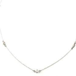 This image showcases a delicate silver chain necklace featuring a central diamond accent, perfect for jewelry buyers and sellers. The necklace's fine craftsmanship and sparkling design make it an attractive piece for those seeking quality jewelry. Necklaces