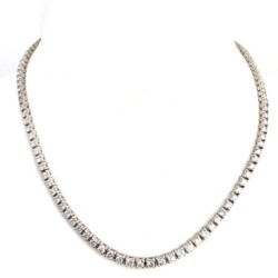 A stunning diamond tennis necklace featuring a continuous line of sparkling, high-quality diamonds set in a luxurious precious metal. Perfect for special occasions or adding a touch of glamour to everyday wear. Necklaces