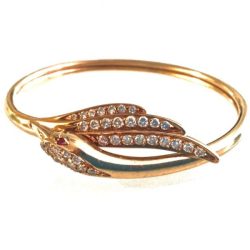 A stunning gold ring featuring a leaf design adorned with sparkling diamonds, perfect for jewelry collectors and enthusiasts showcased in the Galleries collection. Bracelets