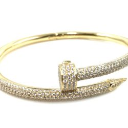 This luxurious gold cuff bracelet features a sleek, open design adorned with sparkling diamonds, perfect for adding a touch of sophistication to any jewelry collection. Ideal for both everyday wear and special occasions. Bracelets