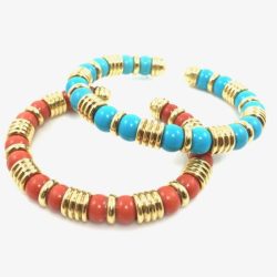 Colorful turquoise and coral beaded bracelets featuring gold spacer accents, perfect for stacking or as statement jewelry pieces. These vibrant accessories add a touch of elegance and bohemian style to any outfit. Bracelets