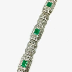 This stunning vintage bracelet features rectangular emeralds set amidst intricate diamond detailing, showcasing exquisite craftsmanship and timeless style. Perfect for collectors and jewelry enthusiasts. Bracelets