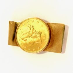 This image features a gold coin with a detailed bull engraving, mounted on a leather strap, highlighting unique jewelry pieces available at our galleries for buying and selling precious items. Bracelets