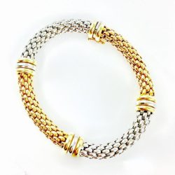Elegant gold and silver mesh bracelet featuring a versatile design, perfect for jewelry collectors and enthusiasts. This piece showcases craftsmanship and luxury, ideal for both everyday wear and special occasions. Bracelets