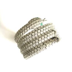 A stunning pair of diamond hoop earrings featuring multiple rows of sparkling diamonds, perfect for adding a touch of luxury to any outfit. Crafted with high-quality materials, these earrings are a timeless addition to any jewelry collection. Bracelets