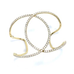 This luxurious gold cuff bracelet features sparkling diamonds arranged in a delicate, open design, perfect for adding a touch of sophistication to any jewelry collection. Ideal for those seeking timeless elegance and high-quality craftsmanship. Bracelets