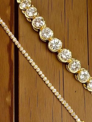 Discover exquisite diamond jewelry on KP Gems, specializing in buying and selling high-quality estate jewelry with exceptional diamonds and craftsmanship. Bezel set 14k yellow gold tennis bracelet with 38 RBC diamonds @ 7.40 carats