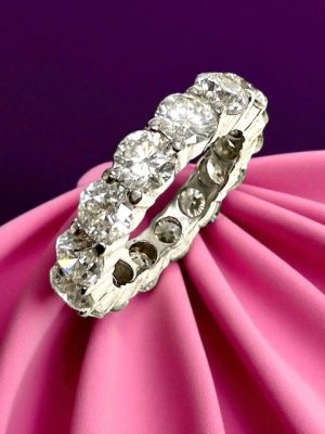 Stunning diamond eternity ring showcasing high-quality gemstones, ideal for purchase and resale at KP Gems. Elegant 6.02 carats round brilliant cut diamonds, white gold eternity band.